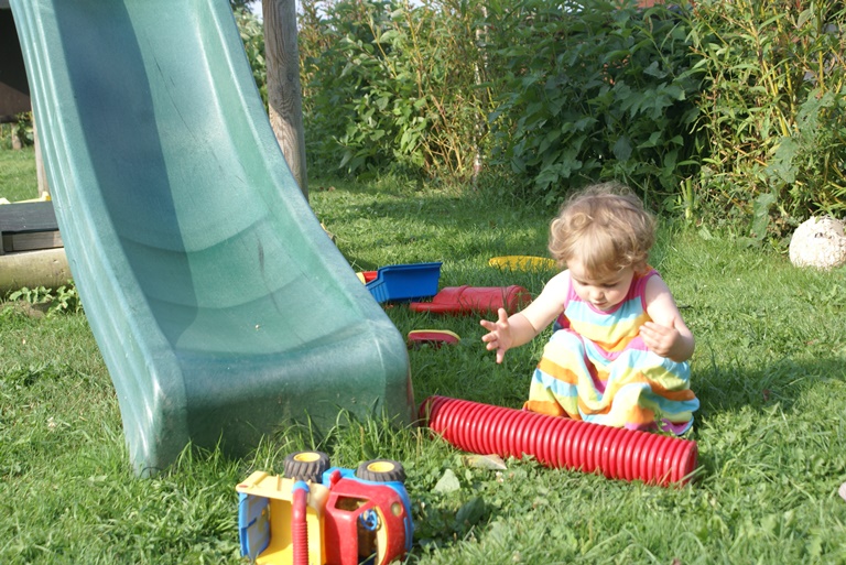 Toddler playing at Eco-Gites of Lenault, a toddler friendly gite in Normandy, France