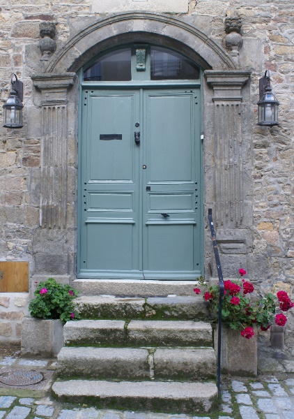 Door with geraniuns in Dinan, Brittany